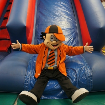 Norris at bottom of slide smiling